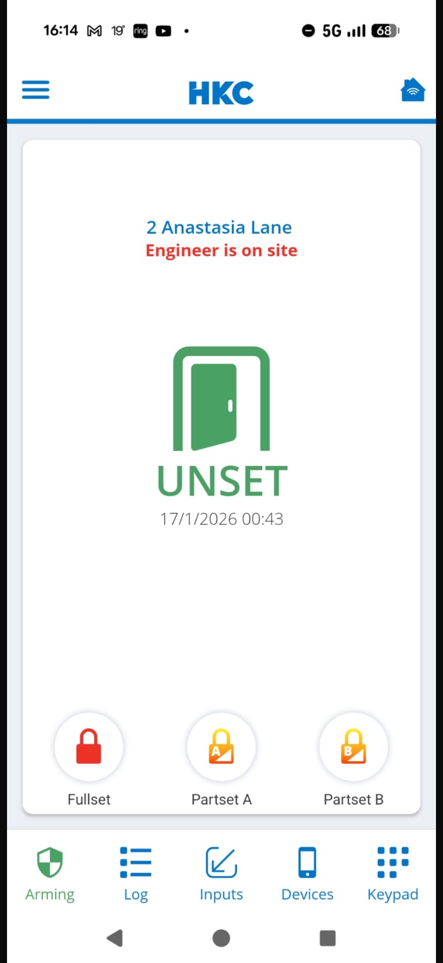 HKC SecureComm app showing alarm status on a smartphone